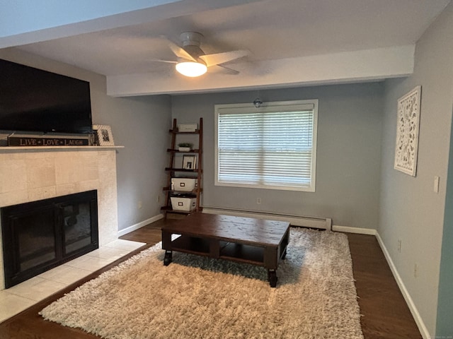 11 Obed Hts, Old Saybrook, CT 06475 - living area with a baseboard radiator, a ceiling fan, a fireplace, and wood finished floors