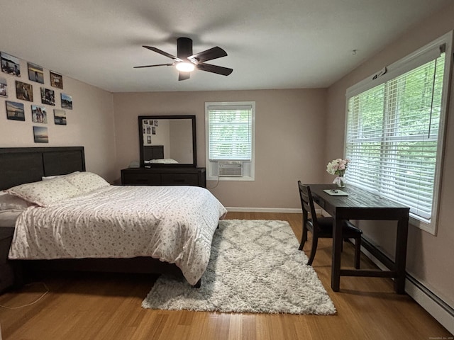 11 Obed Hts, Old Saybrook, CT 06475 - bedroom featuring cooling unit, wood finished floors, and a ceiling fan