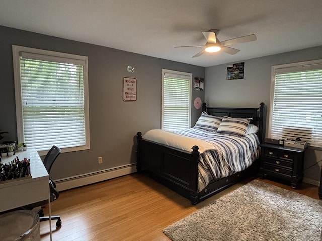 11 Obed Hts, Old Saybrook, CT 06475 - bedroom with a baseboard radiator, light wood finished floors, multiple windows, and a ceiling fan