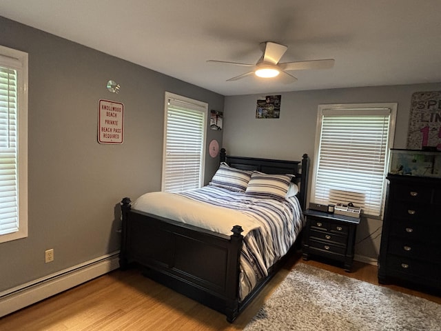 11 Obed Hts, Old Saybrook, CT 06475 - bedroom featuring baseboard heating, wood finished floors, and ceiling fan