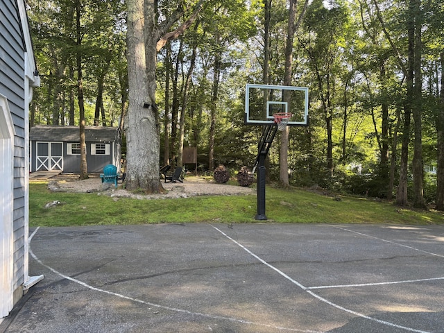 11 Obed Hts, Old Saybrook, CT 06475 - view of sport court featuring a storage shed and basketball hoop