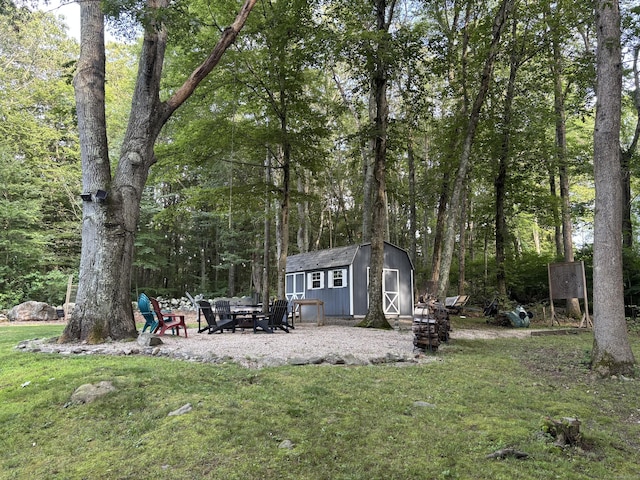 11 Obed Hts, Old Saybrook, CT 06475 - view of green lawn featuring a storage shed and a fire pit