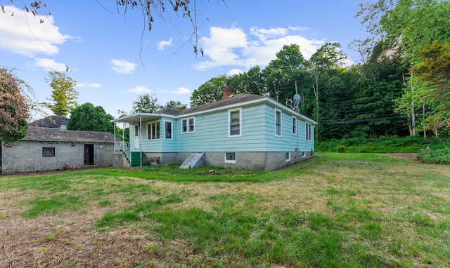 205 Old Norwich Rd, Waterford, CT 06375 - back of house featuring a lawn, a chimney, and stairway