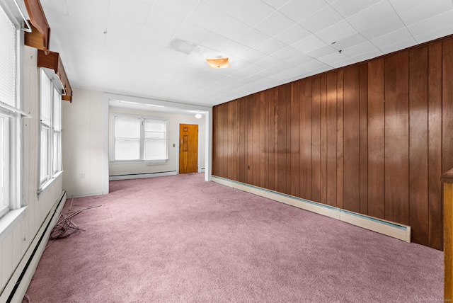 205 Old Norwich Rd, Waterford, CT 06375 - carpeted empty room featuring baseboard heating and wooden walls