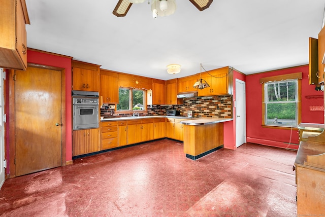 205 Old Norwich Rd, Waterford, CT 06375 - kitchen with stainless steel oven, a peninsula, backsplash, and a ceiling fan