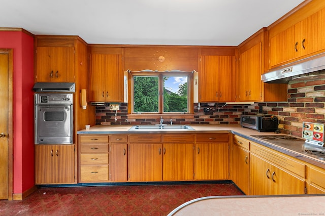 205 Old Norwich Rd, Waterford, CT 06375 - kitchen featuring appliances with stainless steel finishes, under cabinet range hood, light countertops, and brown cabinetry