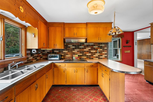 205 Old Norwich Rd, Waterford, CT 06375 - kitchen featuring a peninsula, under cabinet range hood, cooktop, and tasteful backsplash