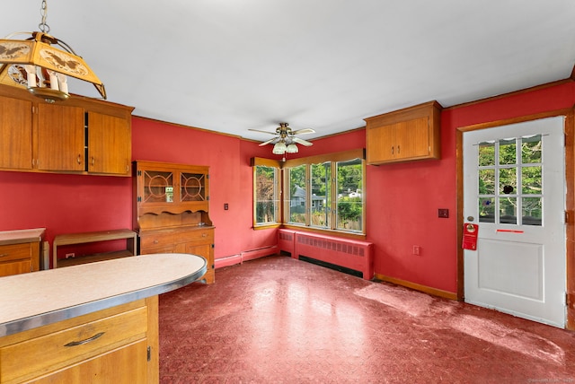 205 Old Norwich Rd, Waterford, CT 06375 - kitchen with radiator, a baseboard heating unit, light countertops, ceiling fan, and brown cabinets
