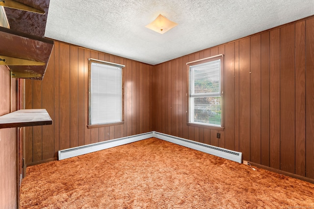 205 Old Norwich Rd, Waterford, CT 06375 - empty room with carpet floors, a baseboard radiator, a textured ceiling, and wood walls