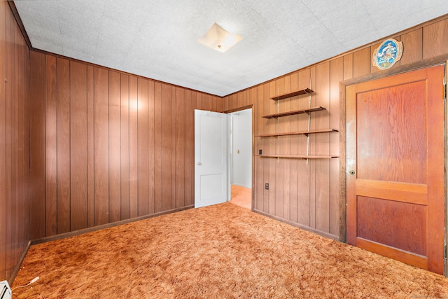 205 Old Norwich Rd, Waterford, CT 06375 - unfurnished bedroom featuring wood walls, carpet flooring, and a baseboard radiator