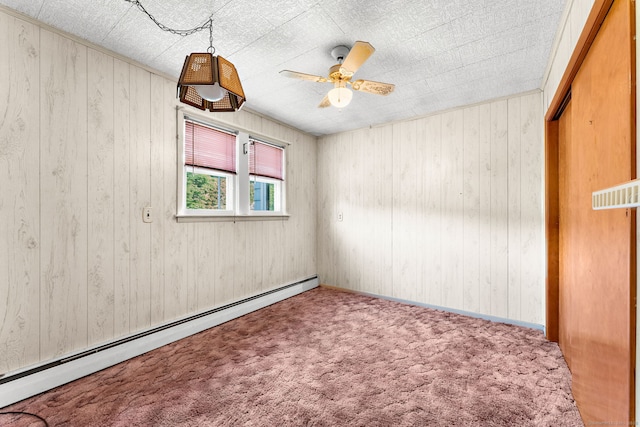 205 Old Norwich Rd, Waterford, CT 06375 - unfurnished room with baseboard heating, ceiling fan, carpet, and wood walls
