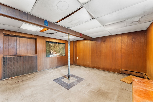 205 Old Norwich Rd, Waterford, CT 06375 - finished below grade area with a paneled ceiling, wood walls, tile patterned floors, and baseboard heating