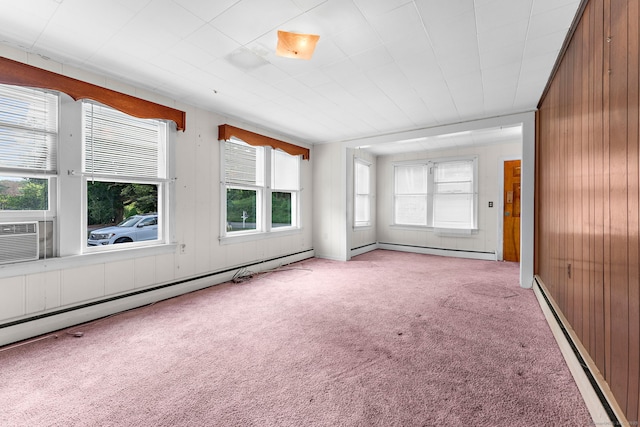 205 Old Norwich Rd, Waterford, CT 06375 - spare room featuring baseboard heating, carpet floors, and wooden walls
