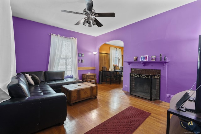 173 Euclid St W, Hartford, CT 06112 - living area featuring arched walkways, a ceiling fan, wood finished floors, healthy amount of natural light, and vaulted ceiling
