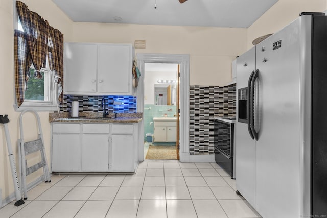 173 Euclid St W, Hartford, CT 06112 - kitchen with stainless steel fridge, range, white cabinets, tasteful backsplash, and ceiling fan