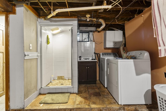 173 Euclid St W, Hartford, CT 06112 - laundry area featuring washer and dryer and cabinet space
