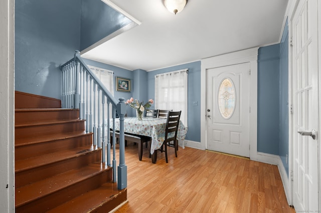 28 W High St, New London, CT 06320 - foyer entrance with light wood finished floors and stairs