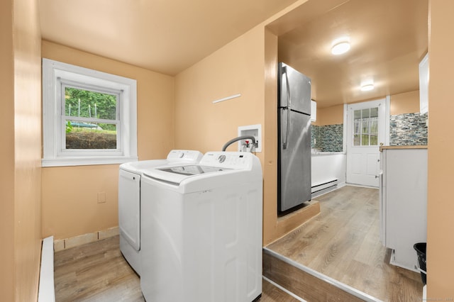 28 W High St, New London, CT 06320 - washroom with baseboard heating, light wood finished floors, and washing machine and dryer