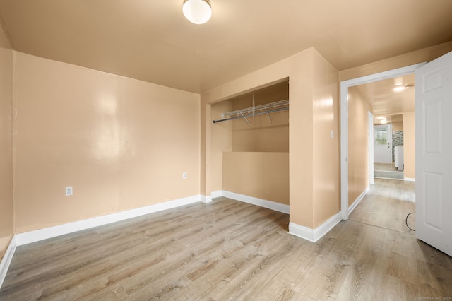 28 W High St, New London, CT 06320 - unfurnished bedroom with wood finished floors and a closet