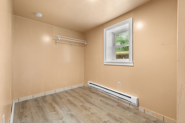 28 W High St, New London, CT 06320 - unfurnished room with a baseboard heating unit, wood finished floors, and a smoke detector