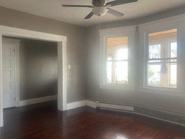 155 Summerfield Ave, Bridgeport, CT 06610 - empty room with dark wood-style flooring, ceiling fan, and a baseboard heating unit