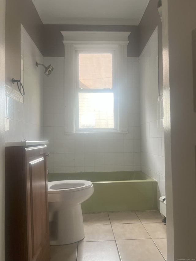 155 Summerfield Ave, Bridgeport, CT 06610 - full bath with tile patterned flooring, tile walls, and a tub to relax in