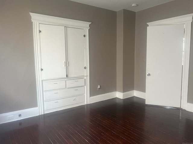 155 Summerfield Ave, Bridgeport, CT 06610 - unfurnished bedroom featuring wood finished floors and baseboards