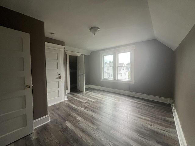 155 Summerfield Ave, Bridgeport, CT 06610 - unfurnished bedroom featuring vaulted ceiling and dark wood finished floors