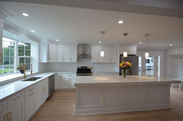 401 Unity Rd, Trumbull, CT 06611 - kitchen with stainless steel appliances, wall chimney range hood, decorative backsplash, healthy amount of natural light, and recessed lighting