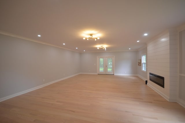 401 Unity Rd, Trumbull, CT 06611 - unfurnished living room with light wood-type flooring, crown molding, recessed lighting, and a fireplace