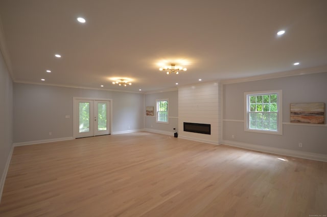 401 Unity Rd, Trumbull, CT 06611 - unfurnished living room featuring ornamental molding, light wood-style flooring, recessed lighting, and a large fireplace