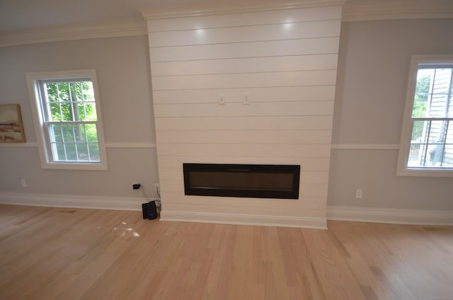 401 Unity Rd, Trumbull, CT 06611 - unfurnished living room featuring wood finished floors, a large fireplace, and crown molding