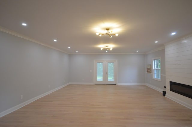 401 Unity Rd, Trumbull, CT 06611 - unfurnished living room featuring crown molding, light wood-type flooring, recessed lighting, a large fireplace, and a chandelier