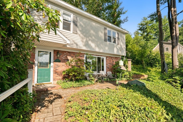 16 Lake St, Burlington, CT 06013 - view of front of property featuring brick siding and a patio