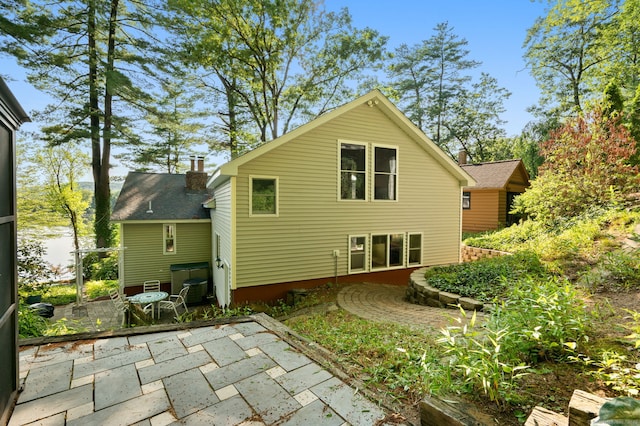 16 Lake St, Burlington, CT 06013 - rear view of property with a patio area and a chimney