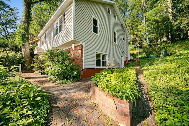 16 Lake St, Burlington, CT 06013 - view of side of home featuring brick siding