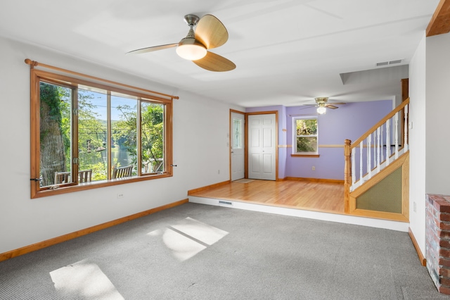 16 Lake St, Burlington, CT 06013 - carpeted empty room with a ceiling fan and stairway