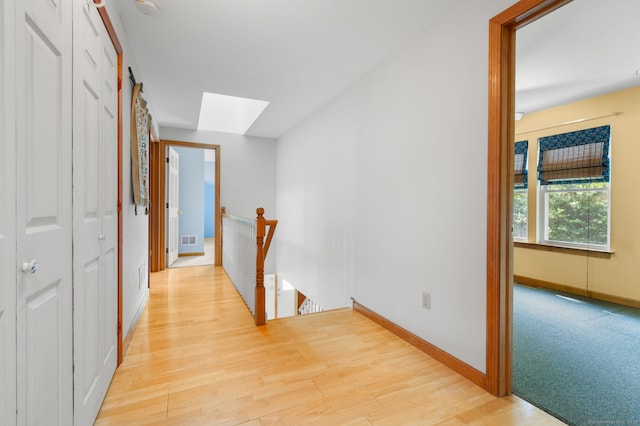 16 Lake St, Burlington, CT 06013 - hallway featuring an upstairs landing, a skylight, and light wood-type flooring