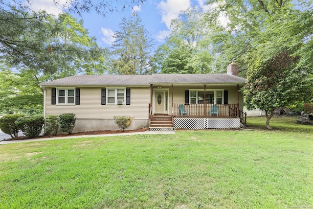 124 Pulaski Hwy, Ansonia, CT 06401 - ranch-style house with covered porch, a front yard, and a chimney
