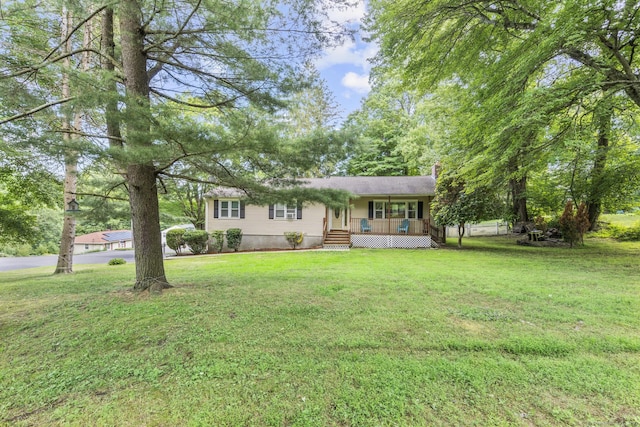 124 Pulaski Hwy, Ansonia, CT 06401 - ranch-style house with a front yard and a chimney