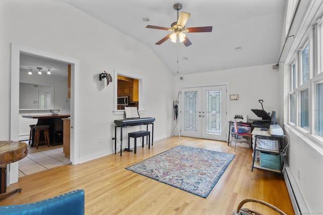 124 Pulaski Hwy, Ansonia, CT 06401 - entryway with a baseboard radiator, vaulted ceiling, french doors, ceiling fan, and wood finished floors
