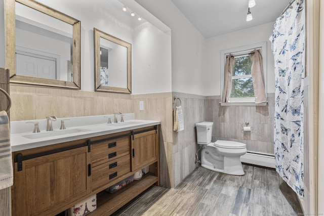 124 Pulaski Hwy, Ansonia, CT 06401 - full bathroom featuring double vanity, wainscoting, tile walls, wood finished floors, and a shower with shower curtain