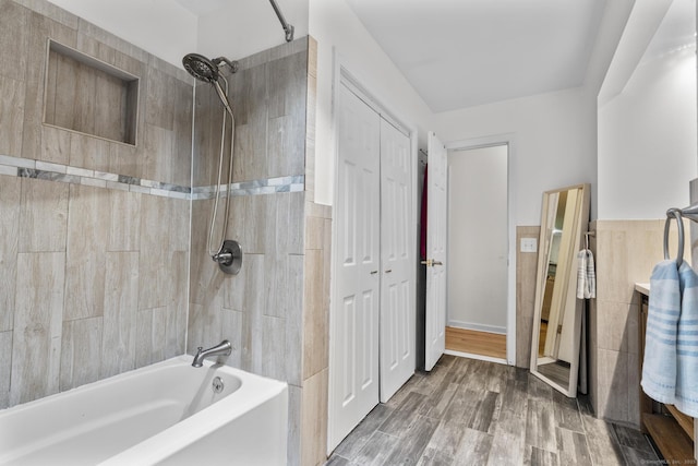 124 Pulaski Hwy, Ansonia, CT 06401 - full bathroom with washtub / shower combination, tile walls, and wood finished floors