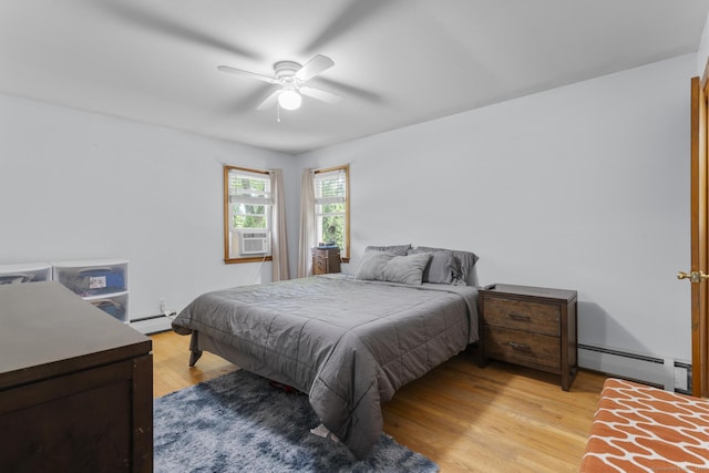 124 Pulaski Hwy, Ansonia, CT 06401 - bedroom with a baseboard heating unit, light wood-style floors, a baseboard radiator, a ceiling fan, and cooling unit