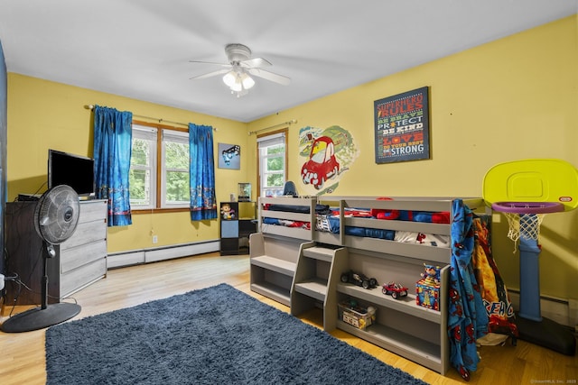 124 Pulaski Hwy, Ansonia, CT 06401 - bedroom featuring a baseboard heating unit, wood finished floors, and a ceiling fan