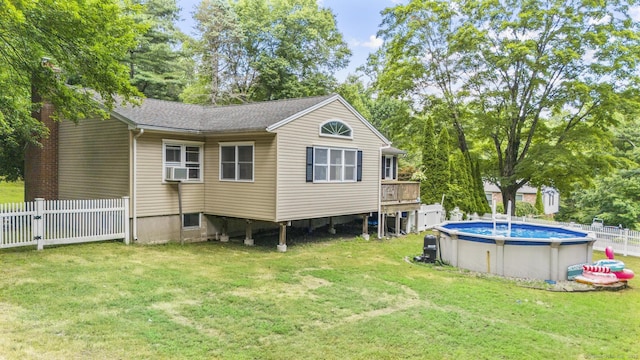 124 Pulaski Hwy, Ansonia, CT 06401 - back of property featuring a fenced backyard, an outdoor pool, and a shingled roof
