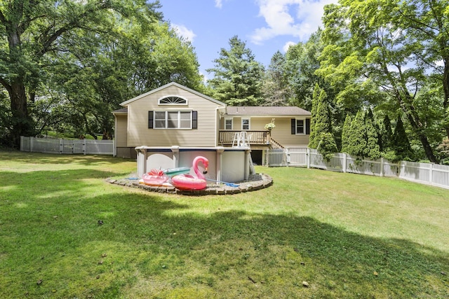124 Pulaski Hwy, Ansonia, CT 06401 - back of property with a fenced backyard, a deck, and view of scattered trees