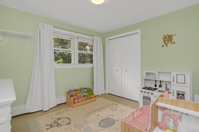 37 Cedar Ln, Beacon Falls, CT 06403 - bedroom featuring wood finished floors, a closet, and a baseboard radiator