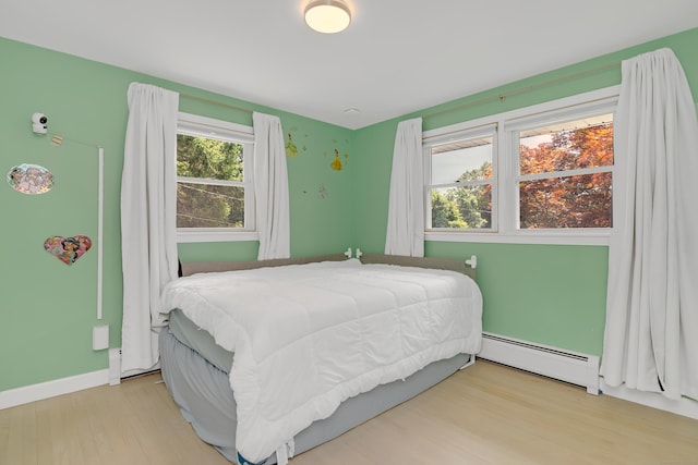 37 Cedar Ln, Beacon Falls, CT 06403 - bedroom featuring a baseboard heating unit and wood finished floors