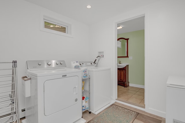 37 Cedar Ln, Beacon Falls, CT 06403 - washroom with washer and clothes dryer and light wood-style floors